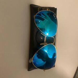 Ray Ban aviator sunglasses.  Gradient blue lens.  Gold metal frame.